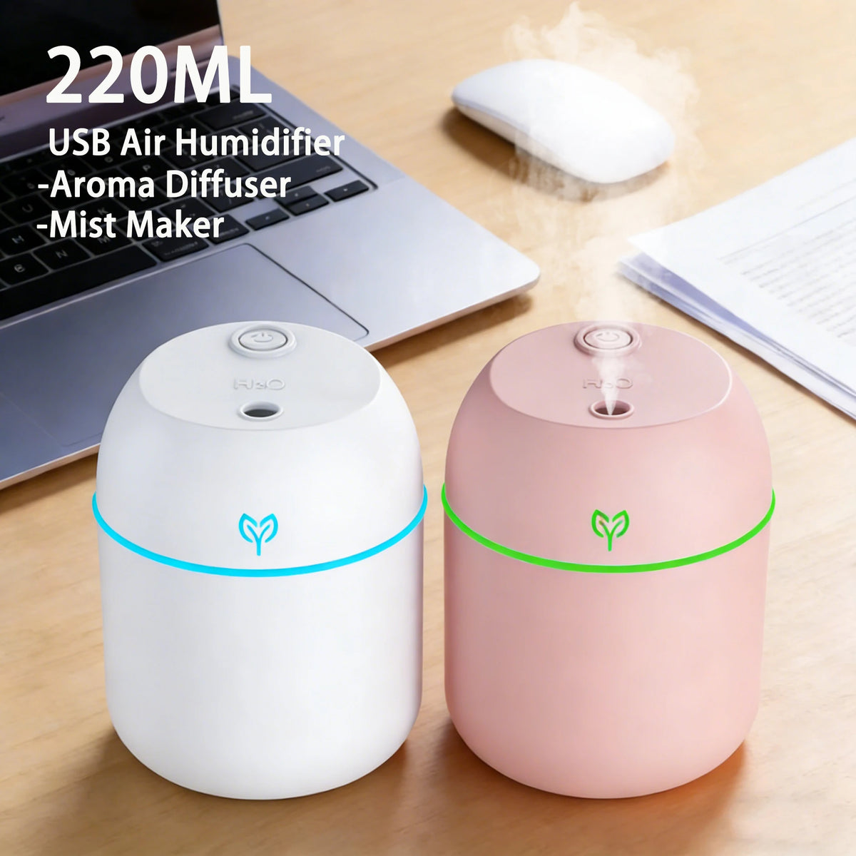 White and pink 220ml USB humidifiers misting on a desk beside a laptop and computer mouse